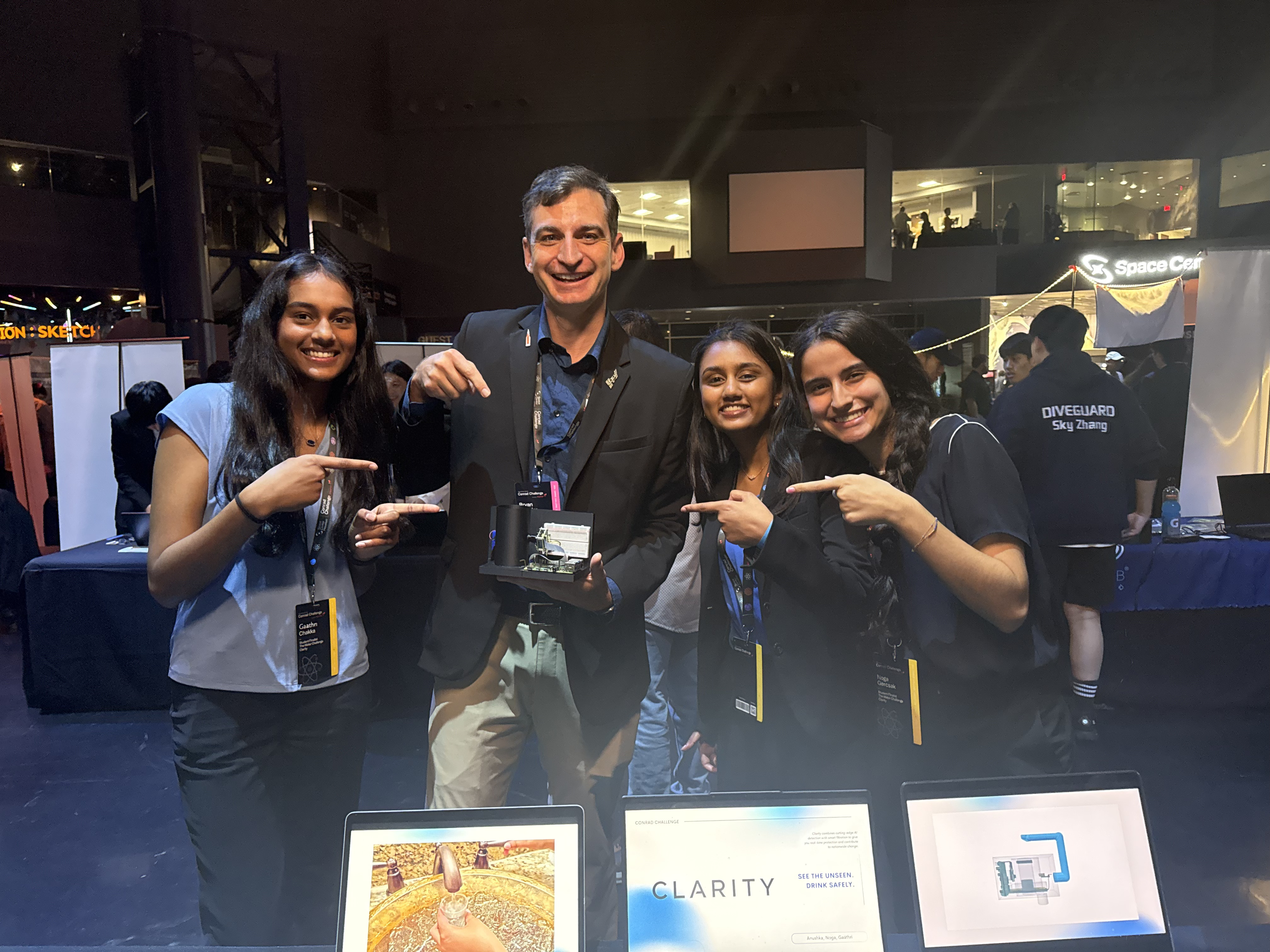 Clarity team with a NASA official at the Conrad Challenge
